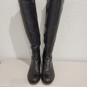 Above the knee black boots